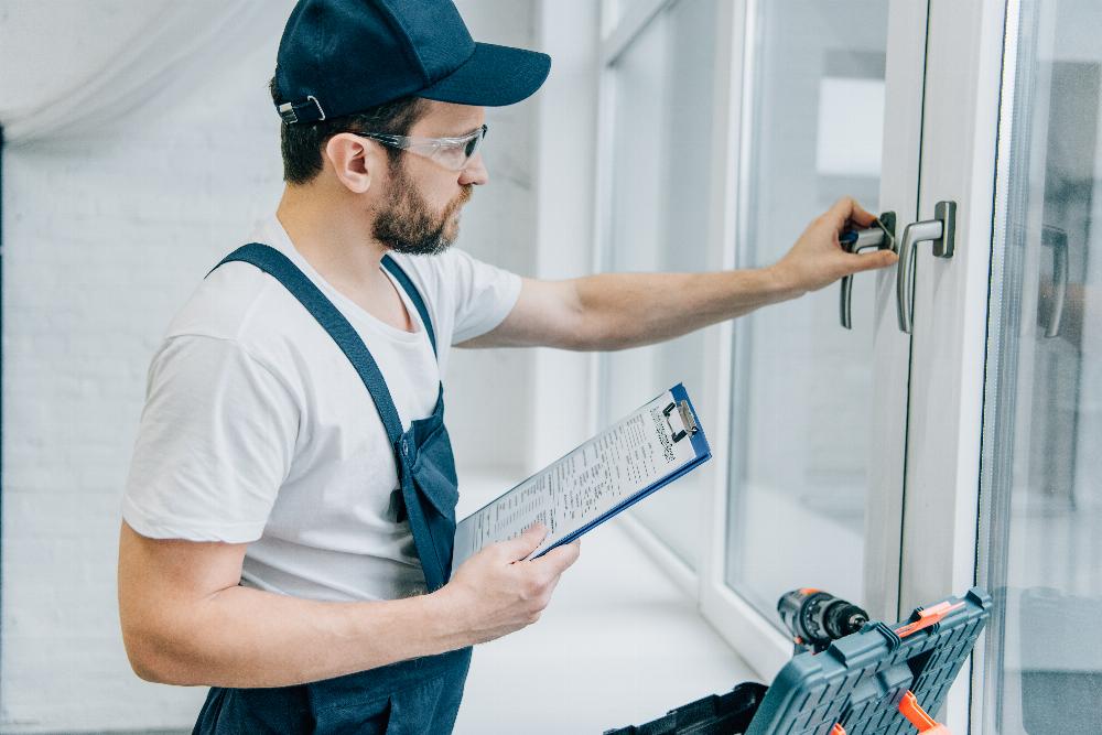 Contractor Inspecting Window with Clipboard