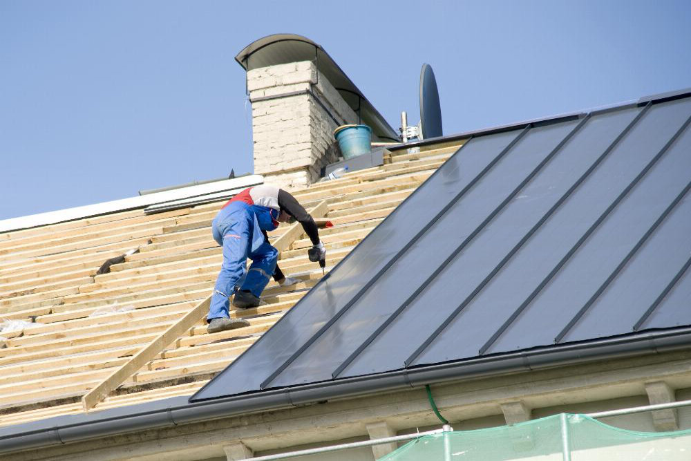 Contractor Roofer Installing Metal Roof