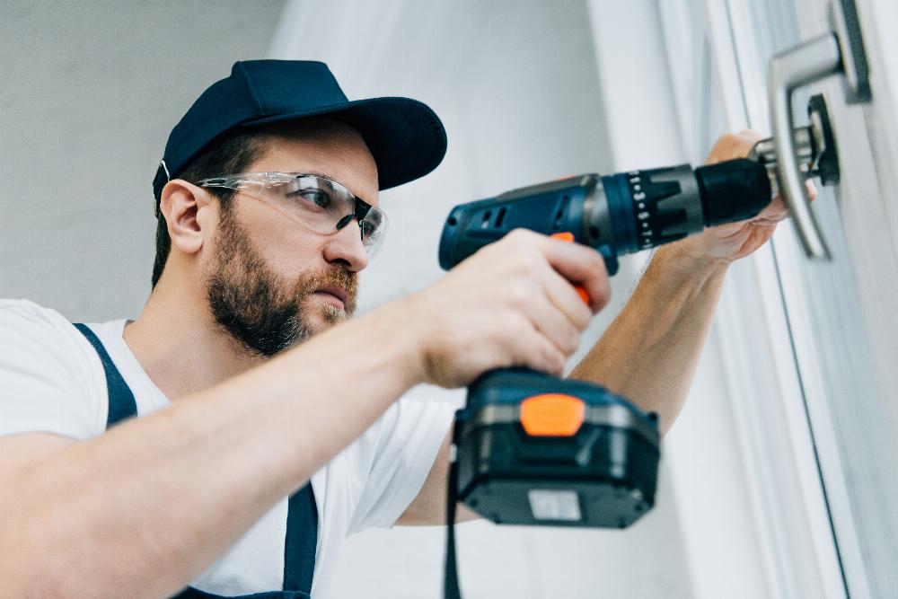 Contractor Screwing in Window with Drill