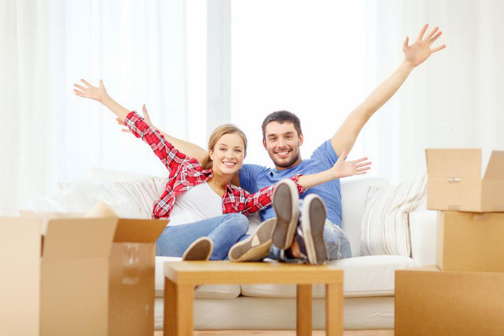 People Family of 2 Moving Sitting on Couch