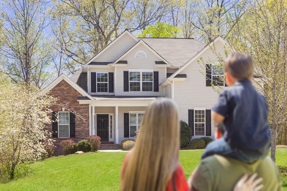 People Family of 3 Young Son Looking at Home